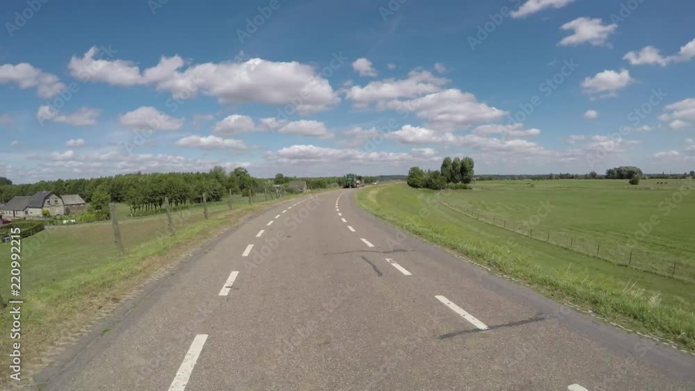 POV driving on polder dike near river Rhine in Holland between Amerongen and Wijk bij Duurstede backwards view POV driving on polder dike near river Rhine in Holland between Amerongen and Wijk bij Duurstede backwards view