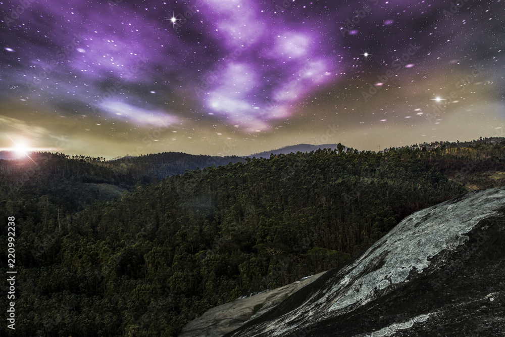 View from the top of a mountain with starry sky and a beautiful sunset, illustration with photo montage