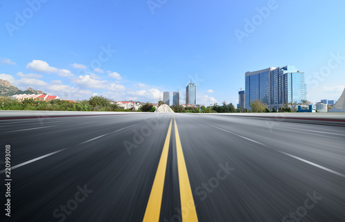 The expressway and the modern city skyline are in Chongqin.g  China