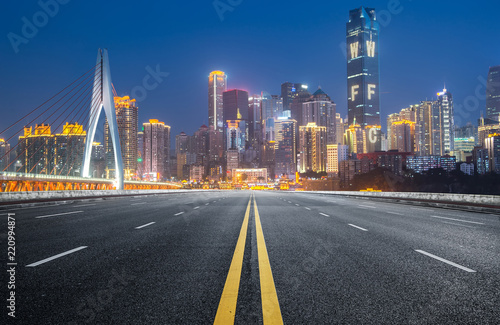 The expressway and the modern city skyline are in Chongqing, China.