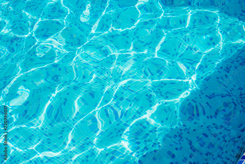 Bright blue surface swimming pool water background