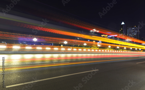 abstract image of blur motion of cars on the city road at night，Modern urban architecture in guangzhou, China