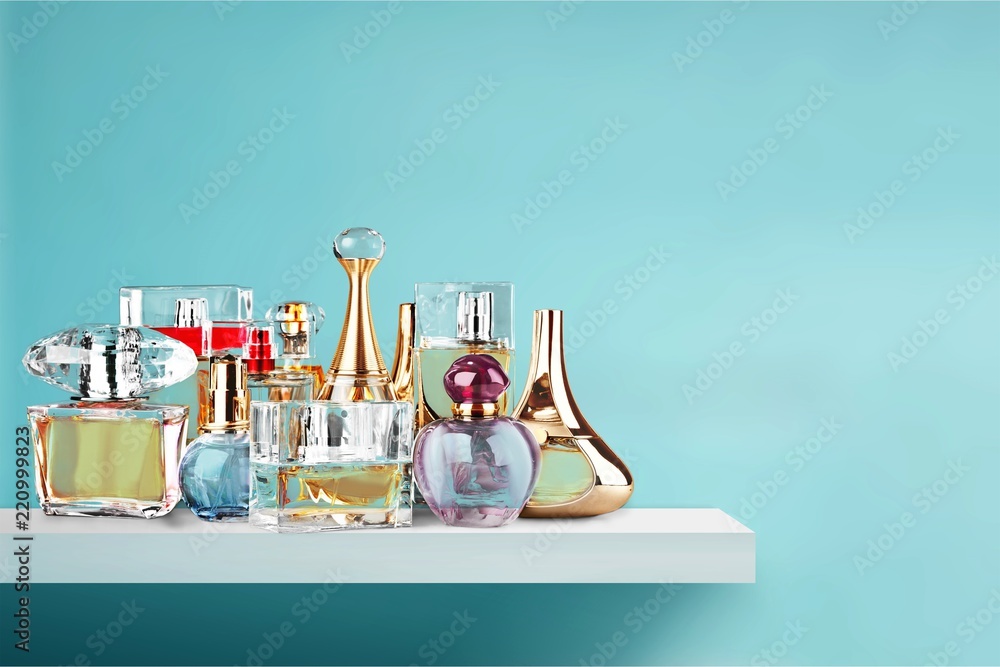 Aromatic Perfume bottles on wooden table on blurred background - obrazy, fototapety, plakaty 