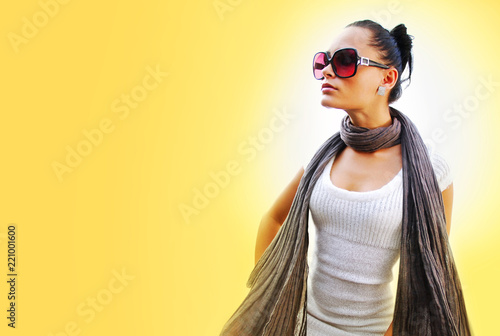 woman with brown scarf on yellow background