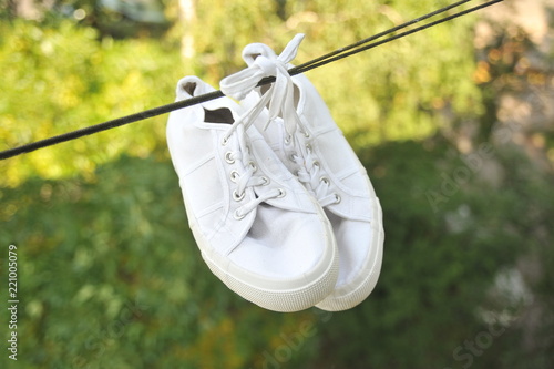 white sneakers in a rope