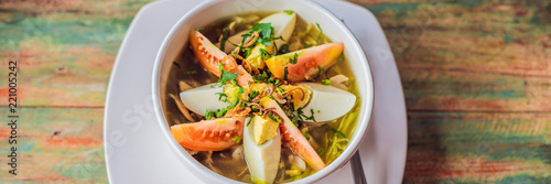Soto is a traditional Indonesian soup mainly composed of broth, chicken and vegetables BANNER, long format photo