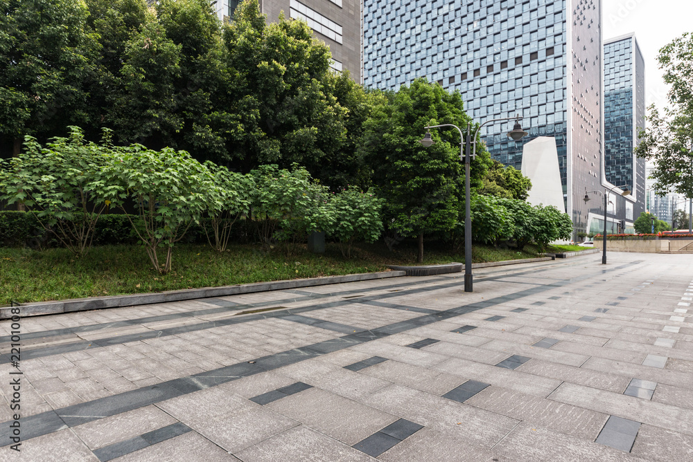 Panoramic skyline and buildings with empty concrete square floor in chengdu,china Panoramic skyline and buildings with empty concrete square floor in chengdu,china