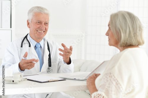Portrait of senior doctor with a elderly patient