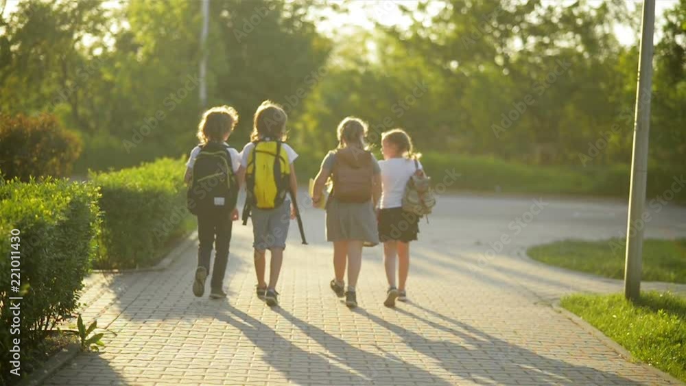 Group of Pupils with School Backpacks Are Going Back to School. They Are Having a Lot of Fun. Group of Pupils with School Backpacks Are Going Back to School. They Are Having a Lot of Fun.