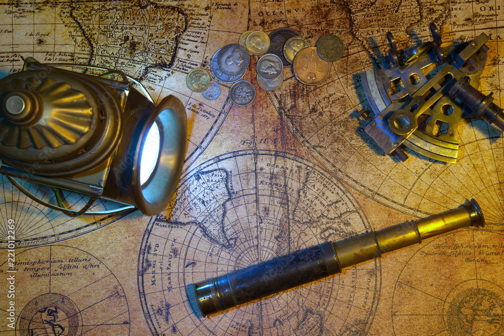 Fototapeta premium Ship lantern, compass, old coins and sextants. Travel and marine engraving background.Pirate map. Retro style.
