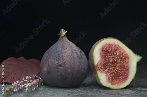 Fresh figs on dark background, blue violet figs with as close up.