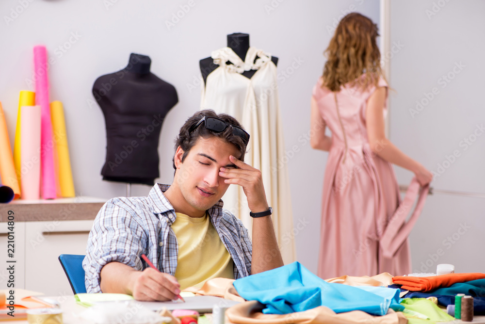 Fototapeta premium Young tailor working in his workshop