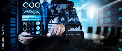 Investor analyzing stock market report and financial dashboard with business intelligence (BI), with key performance indicators (KPI).businessman hand working with finances 
