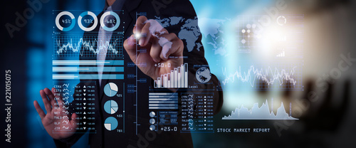 Obraz na plátně Investor analyzing stock market report and financial dashboard with business intelligence (BI), with key performance indicators (KPI)