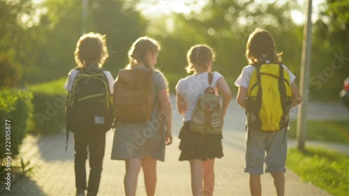 A Group of Students Return To The School Together. They Have a Lot of Fun Talking to Each Other.