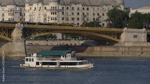 Pest-Buda boat in Budapest on the Danube, floats in front of the Margit bridge - stabilized Cinelike-D