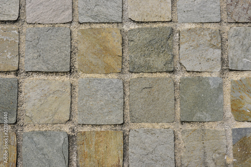 Mur en mosaïque de pierres carrées