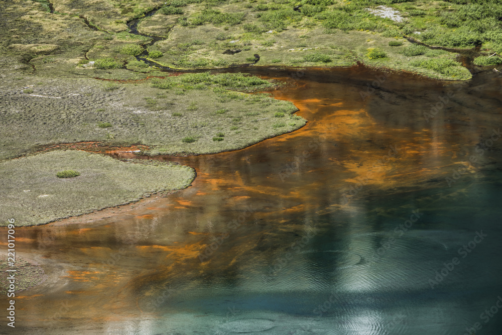 A lake with blue and orange color