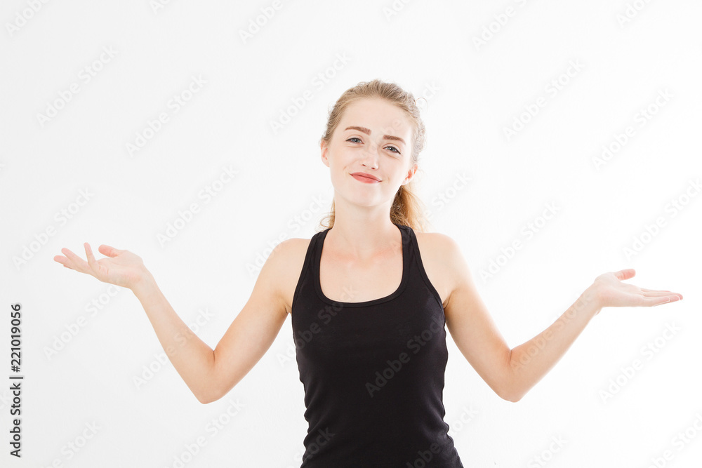 A happy girl spreads her hands on a white isolated background. Woman in shirt.