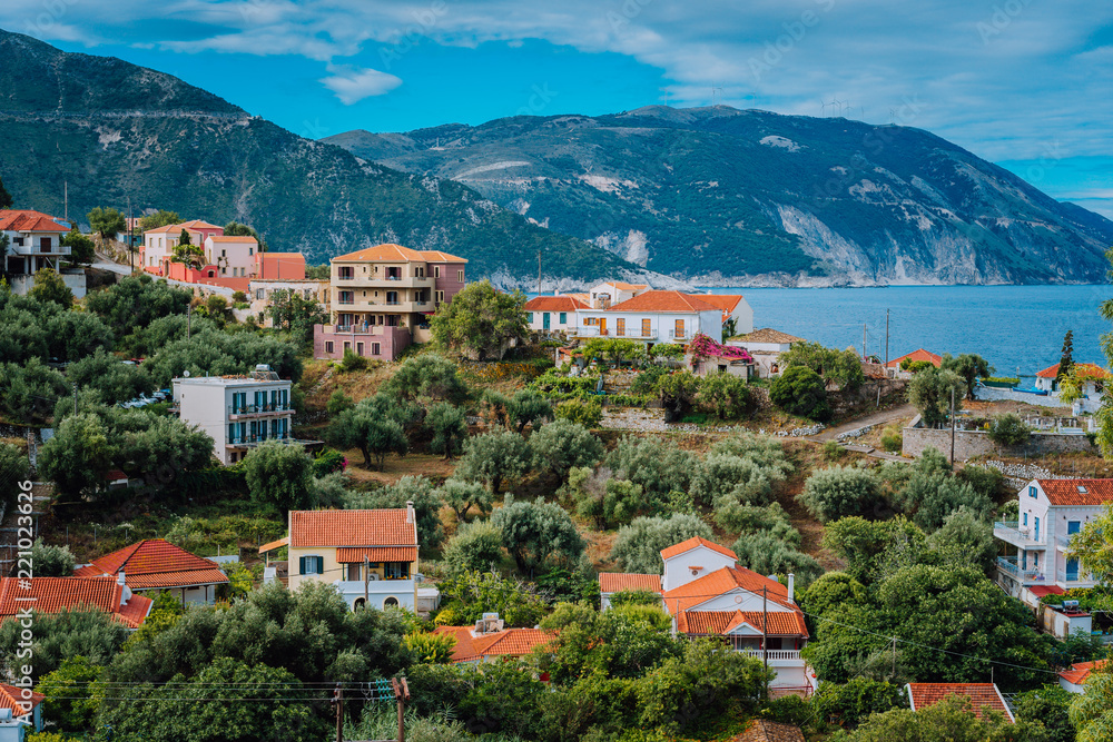 Cozy town, relaxing, summer feeling. Red roofs of Assos village at the lush green Mediterranean place of Kefalonia Island