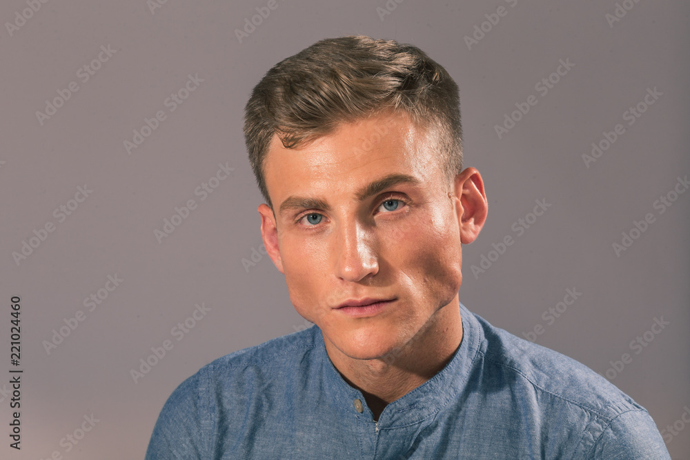 Fototapeta premium Handsome man posing in the studio for clothes shooting