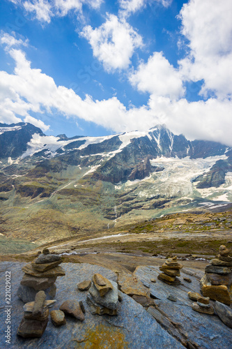 Stone pyramids in front of the Grossglockner Mountain Group, viewed from the Wasserfallwinkel viewing point, showing the various stone colors, and the Greenstone, Prasinit that it is known for photo