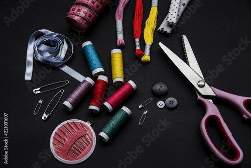 Sewing materials on the black background