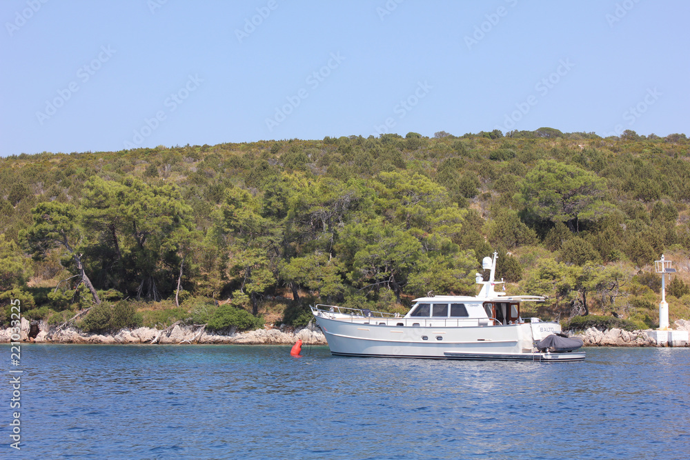 Sail boat on blue water Sail boat on blue water