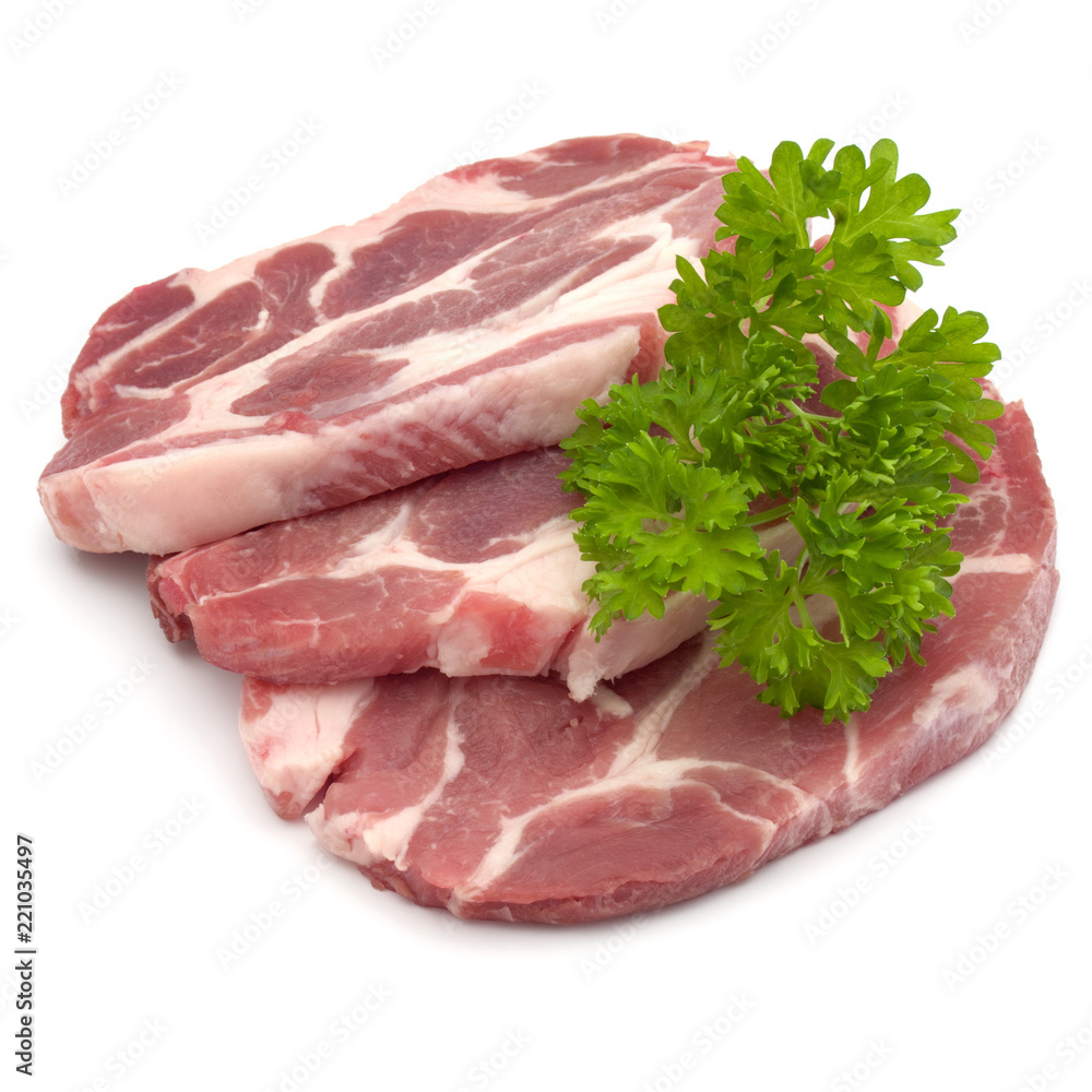 Raw pork neck chop meat with parsley herb leaves garnish isolated on white background cutout Raw pork neck chop meat with parsley herb leaves garnish isolated on white background cutout