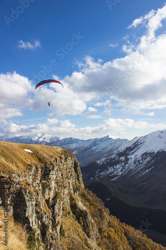 parasailing over caucasian mountains