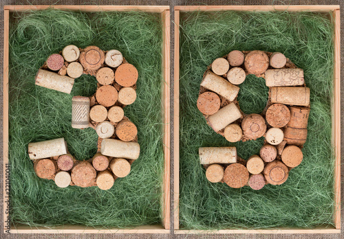 Number 39 thirty nine  made of wine corks on green background in wooden box photo