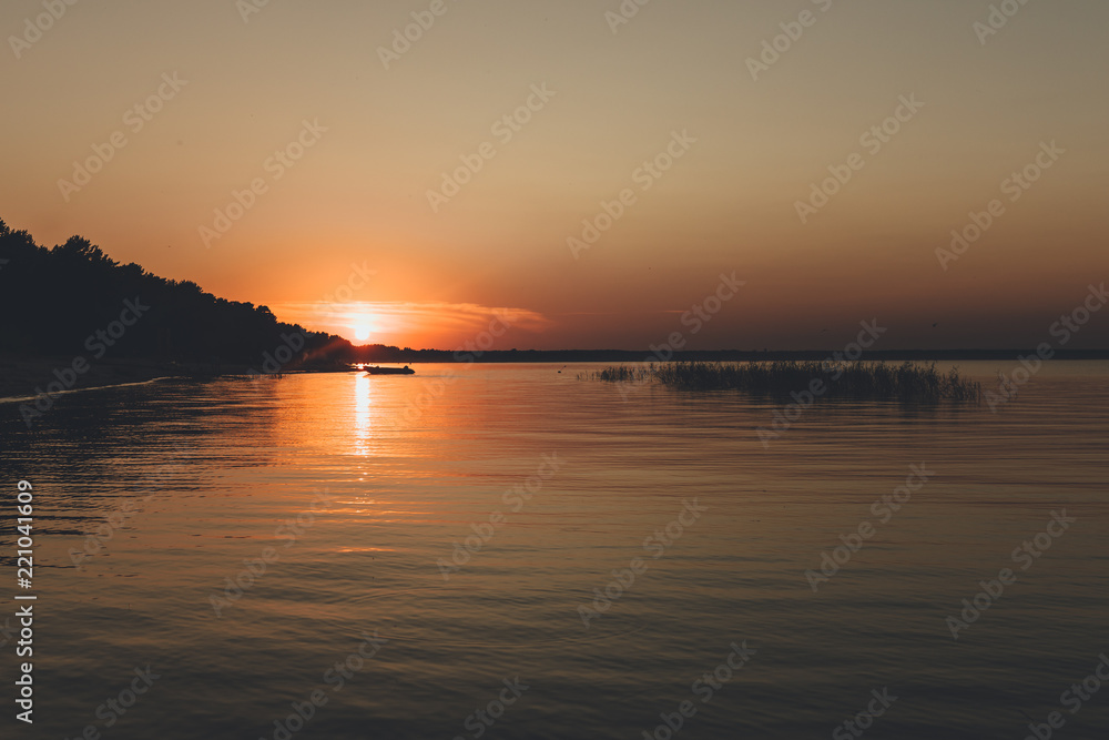 lake sunset with sun reflection