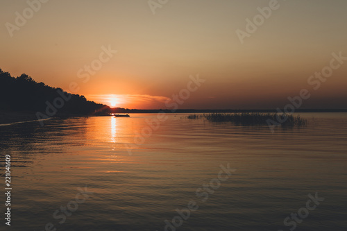 lake sunset with sun reflection