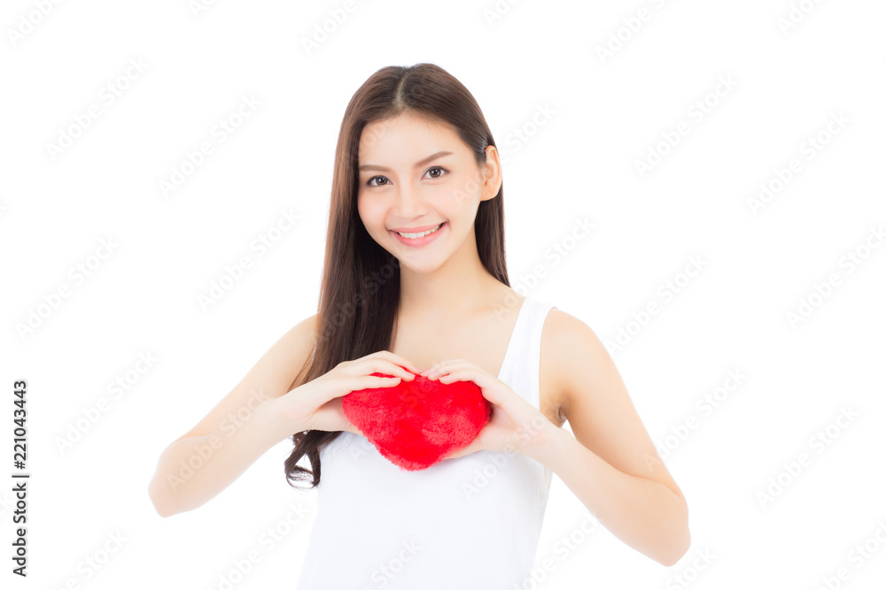 Portrait of beautiful asian young woman holding red heart shape pillow and smile isolated on white background, valentines day, holiday concept. Portrait of beautiful asian young woman holding red heart shape pillow and smile isolated on white background, valentines day, holiday concept.