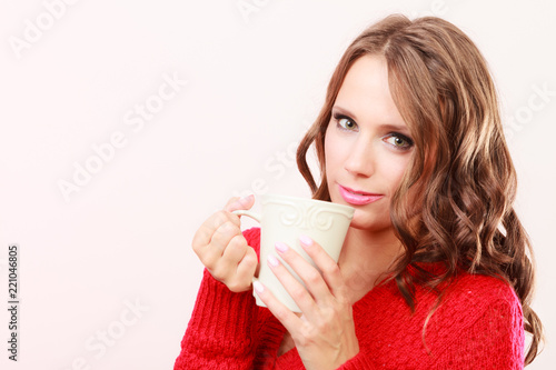 Autumn woman holds mug with coffee warm beverage