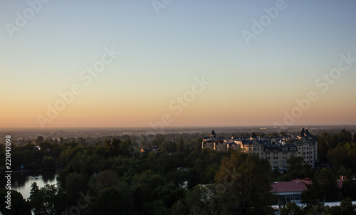 view of the city and the lake at sunset in Almaty © Natalya