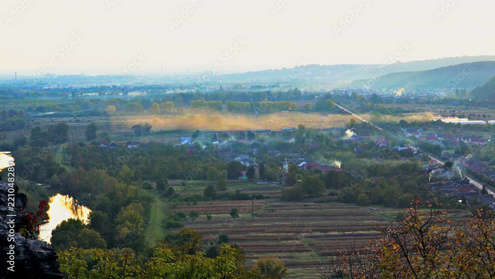 Landscape in autumn the mountain morning a fog on the mountain