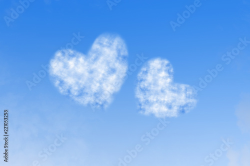 White cloud on blue sky, heart-shaped.