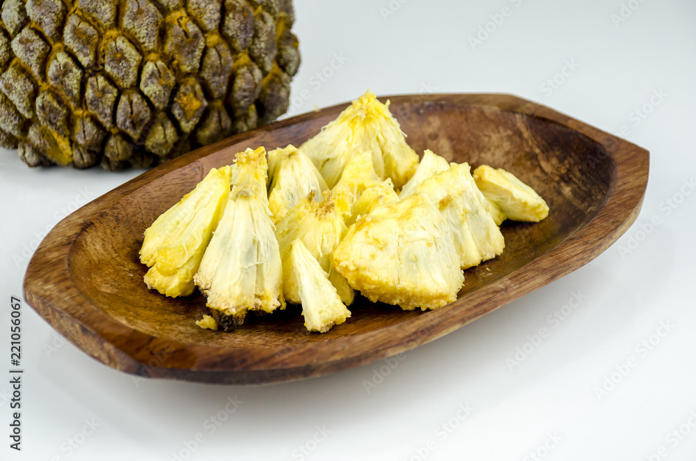 Edible part of marolo, araticum or bruto fruit on wooden bowl . Tropical fruit of the original inhabitants of Brazil and Paraguai. Scientific name ; Annona crassiflora. Edible part of marolo, araticum or bruto fruit on wooden bowl . Tropical fruit of the original inhabitants of Brazil and Paraguai. Scientific name ; Annona crassiflora.
