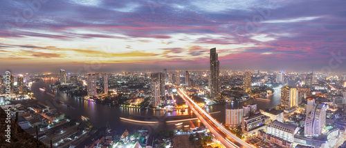 Bangkok capital city of thailand.Scenic landscape of Bangkok skyline with dramatic sky before sunset with modern skyscraper and Chao Phraya river in background.