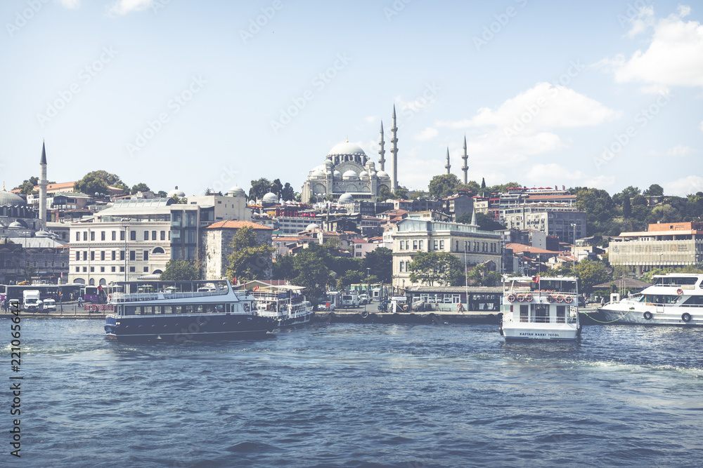 Passenger ships and reflections in the Gulf of the Golden Horn in Istanbul, Turkey.