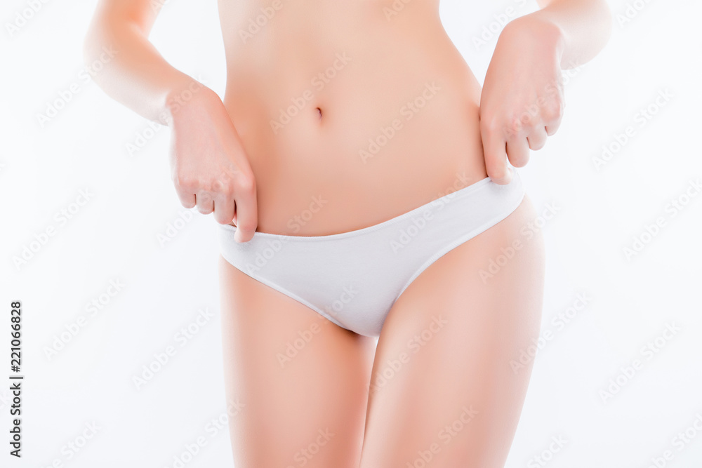 Cropped close up photo of woman's skinny slim thin hips in cotto