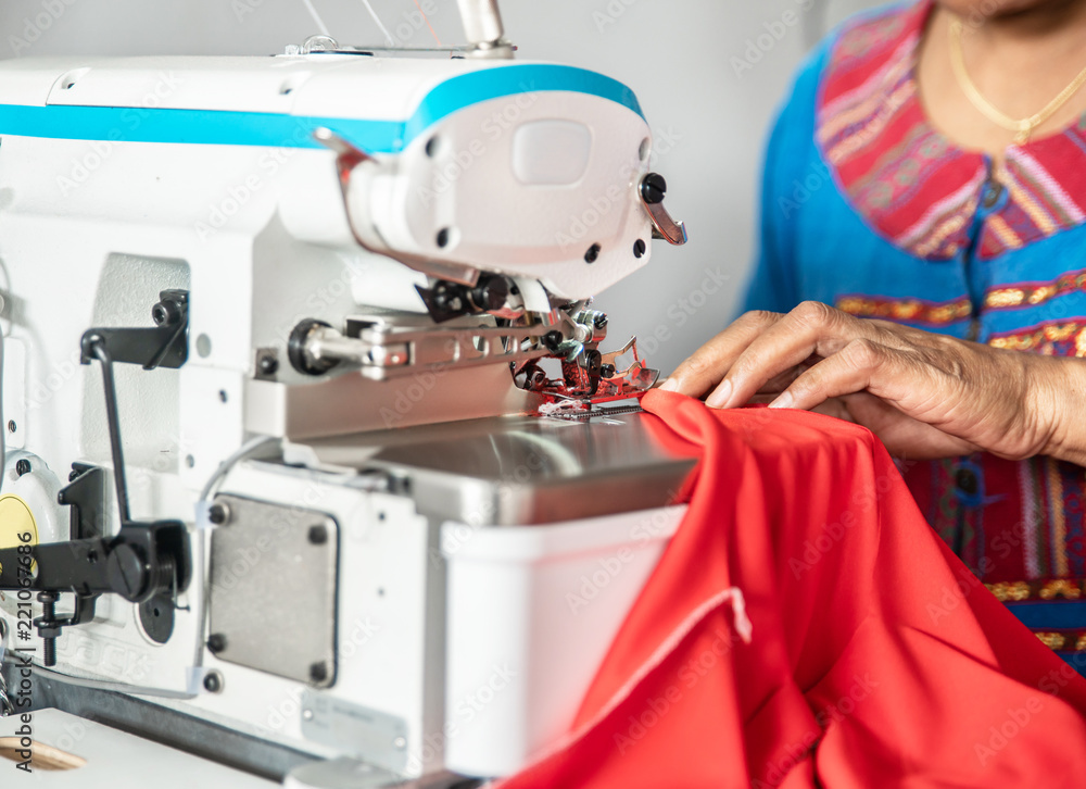 seamstress at work on a sewing machine.