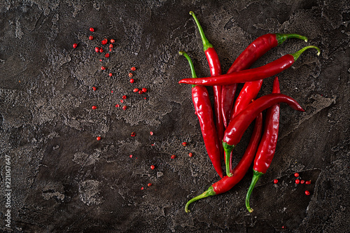фотография Red hot chili peppers  on grey table. Top view