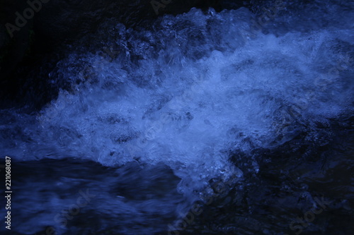 Pure crystal water spalsh with dark blue background in azad kashmir