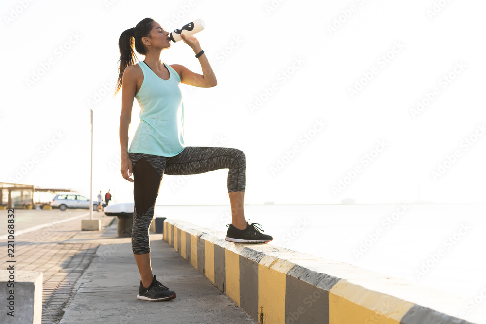 Woman Running Bottle Image & Photo (Free Trial)