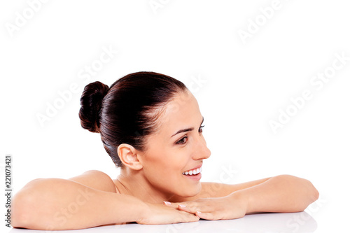 Portrait of smiling nude woman isolated on white background.