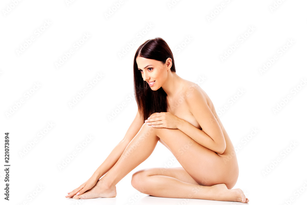 Fototapeta premium Young nude woman sitting on the floor