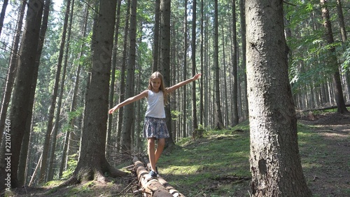 Fotografie Child in Forest Walking on Log, Girl Camping, Kid In Mountains Outdoor in Wood