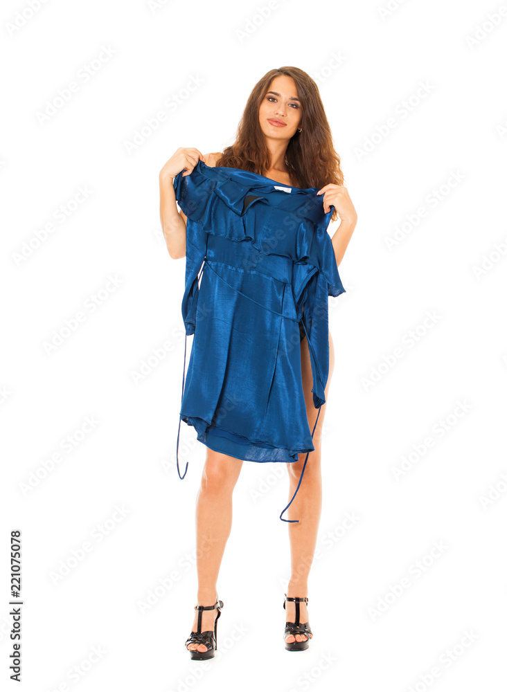 Full length portrait of young beautiful sexy woman in lingerie trying on dress Full length portrait of young beautiful sexy woman in lingerie trying on dress